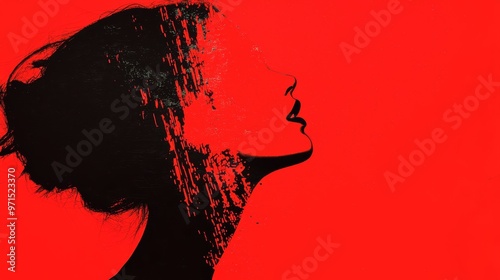  A profile painting of a woman in red and black, with hair swept back photo