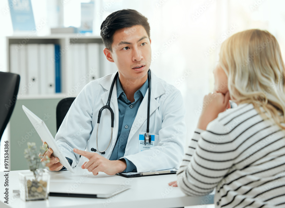 Hospital, tablet and doctor with woman for consulting, medical service and online diagnosis. Healthcare, clinic and person talking to patient on digital tech for results, insurance and wellness Hospital, tablet and doctor with woman for consulting, medical service and online diagnosis. Healthcare, clinic and person talking to patient on digital tech for results, insurance and wellness
