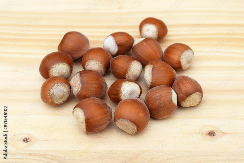 Hazelnuts in shell on a wooden background Hazelnuts in shell on a wooden background