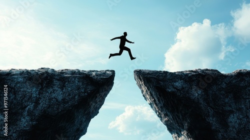 Wallpaper Mural Action Beats Readiness: A figure jumping over a gap between two cliffs without a bridge, symbolizing taking action even without feeling fully ready Torontodigital.ca
