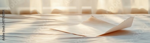 Torn love letter on an empty bed, heartbreak, emotional aftermath of love