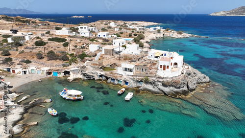 Aerial drone photo of picturesque seaside area and bay of Goupa - Karra with colourful boat houses and elephant rock a perfect place to swim, Kimolos island, Cyclades, Greece