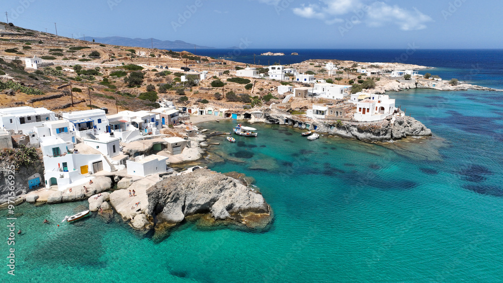 Aerial drone photo of picturesque seaside area and bay of Goupa - Karra with colourful boat houses and elephant rock a perfect place to swim, Kimolos island, Cyclades, Greece Aerial drone photo of picturesque seaside area and bay of Goupa - Karra with colourful boat houses and elephant rock a perfect place to swim, Kimolos island, Cyclades, Greece