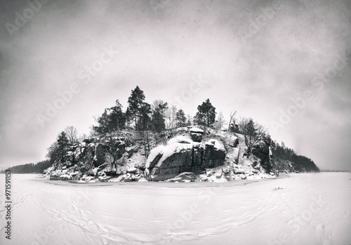 a frozen lake, snow covered trees