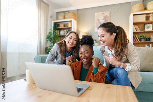 Joyful Diverse Female Friends Using Laptop at Home