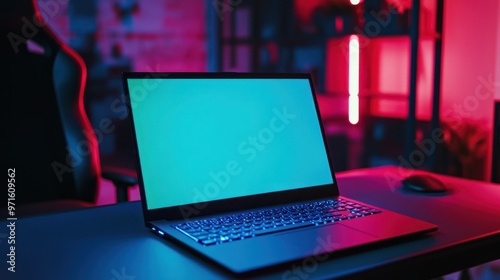 Laptop with Green Screen in a Modern Gaming Setup