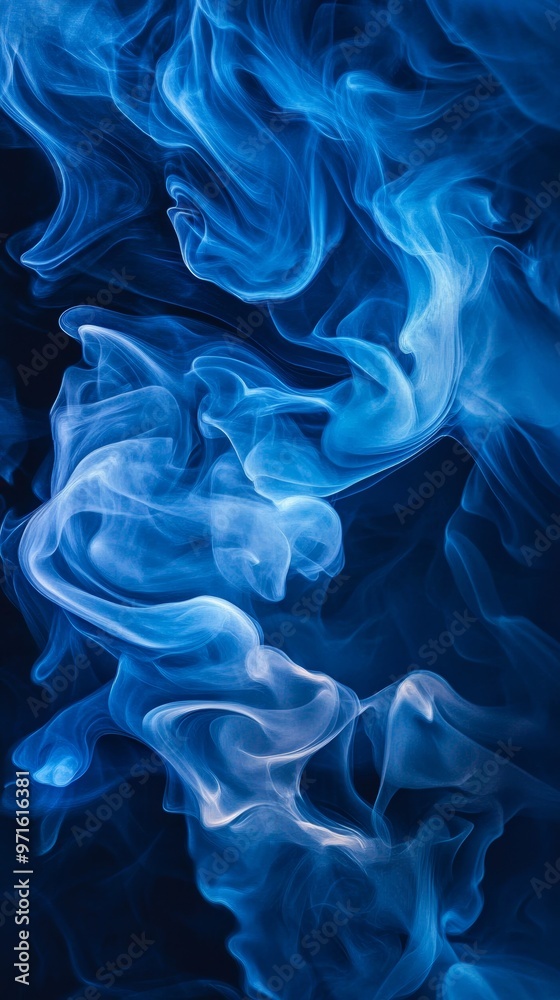 Blue smoke billowing on a black background forming abstract shapes Blue smoke billowing on a black background forming abstract shapes
