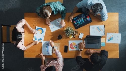 Top view of business team attend meeting while prepare working and analyzing data. Group of diverse people planning creative and working on start up project while team joining conference. Convocation.