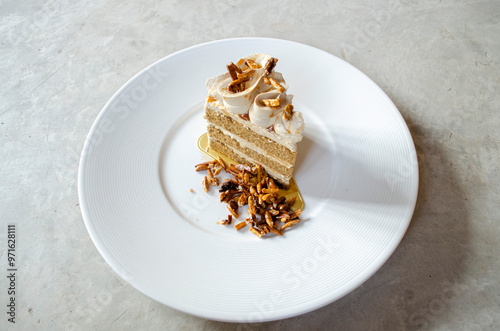 coffee almonds cake in white plate on loft background