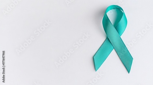 Sexual Assault Awareness: A Calming Teal Ribbon on White Background with Ample Copy Space for Messaging About Healing and Survivor Support