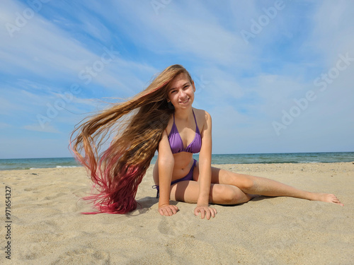 beautiful girl with long hair on the beach, woman posing on the sand, travel to tropical countries, girl smiling, childhood, teenagerм