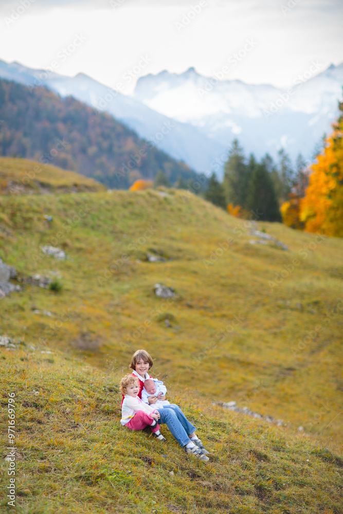 Family with kids hiking in the mountains Family with kids hiking in the mountains