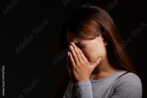 Sad, woman and crying with mockup space for abuse, mental illness or emotional pain in studio on a black background. Female person, model or psychosis with anxiety, depression or stress for insomnia