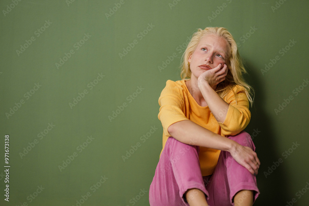 Stressed Young Woman on Green Background Stressed Young Woman on Green Background