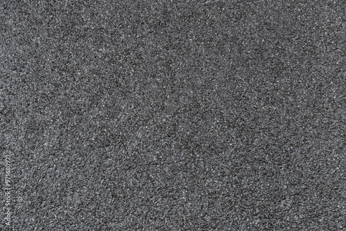 New wet asphalt texture. A frame filled with the textured surface of dry asphalt, showcasing the detailed pattern after rain