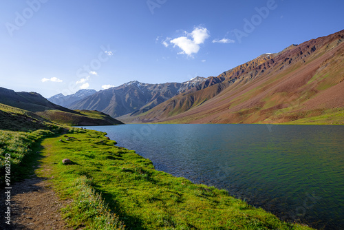 Photography Chandratal lake, Moon Lake during Sunset with crystal clear water in between mountains surrounded by snowcapped mountains