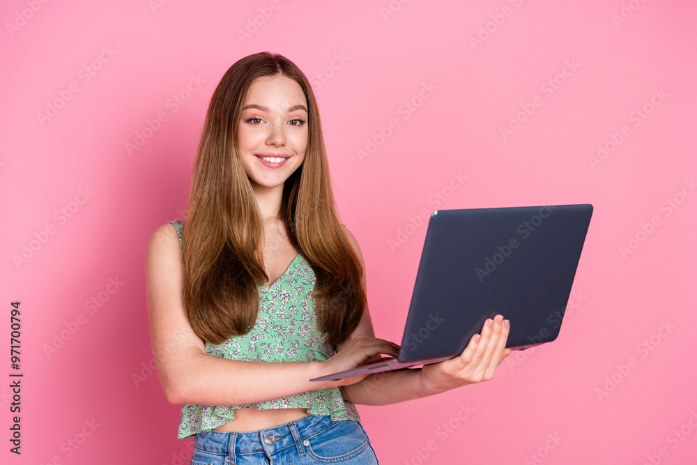 Portrait of pretty young girl use laptop wear top isolated on pink color background Portrait of pretty young girl use laptop wear top isolated on pink color background