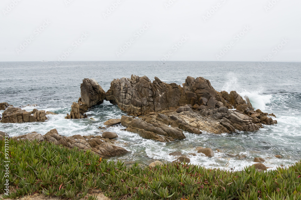 Waves breaking on the Kissing Rocks in the ocean Waves breaking on the Kissing Rocks in the ocean