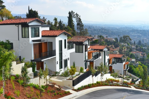 The architecture of a white contemporary townhouse building a city. photo