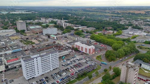 Terminus House building with cars parking in the car park outside in Harlow Town, England