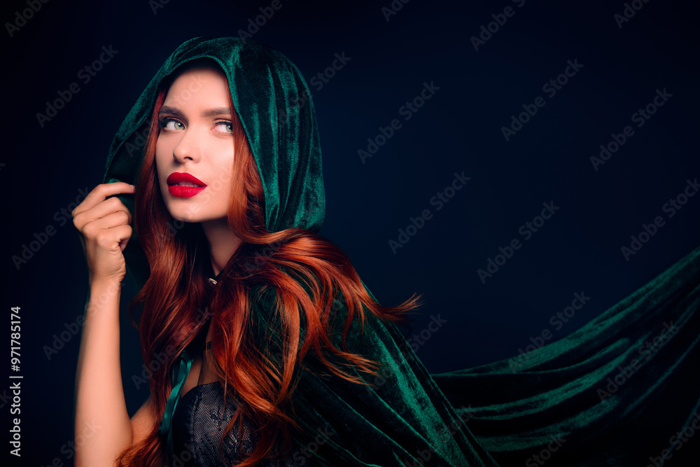 Photo of stunning girl look evil witch empty space wear green hood cape cloak isolated dark blue color background Photo of stunning girl look evil witch empty space wear green hood cape cloak isolated dark blue color background