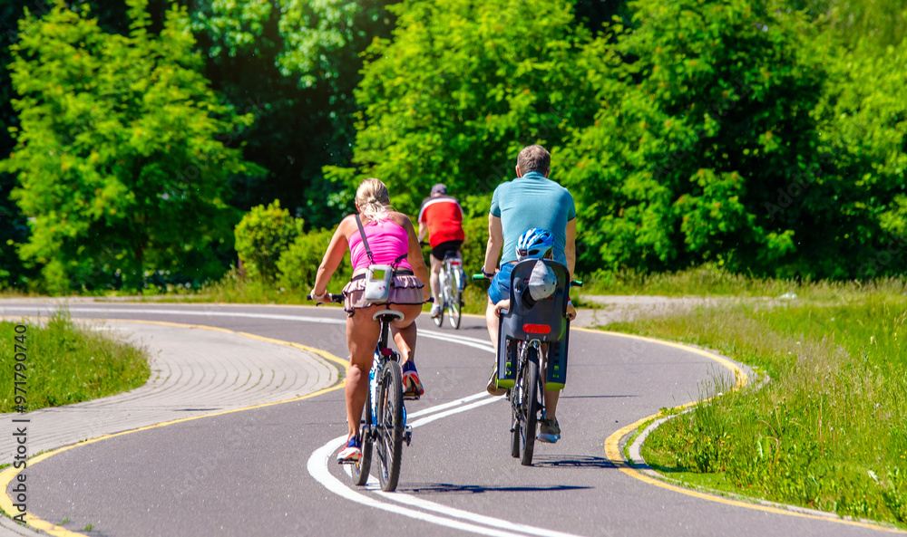 Cyclists ride on the bike path in the city Park
Cyclists ride on the bike path in the city Park