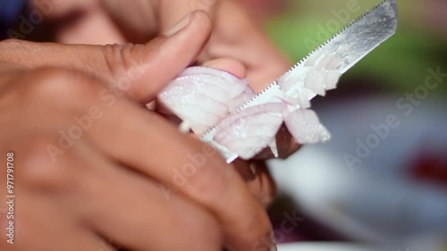 Close-Up of Onion Being Sliced with Knife in Sunlight - Slow-Motion HD