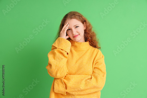 Thoughtful young woman on g...