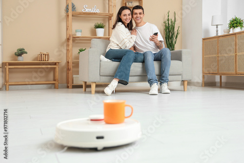 Young couple using mobile p...