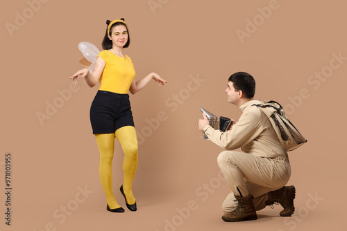 Male beekeeper with smoker ...