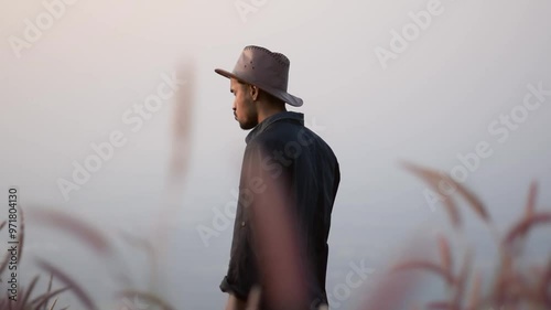 A man in hat looking around slow motion hd video 