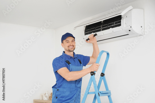 Male technician with flashl...