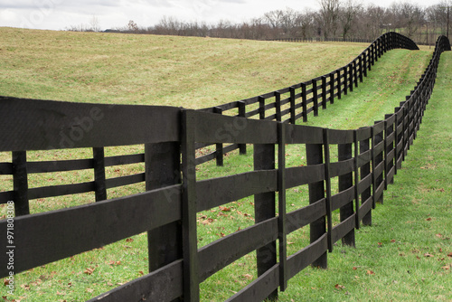 Rolling grassy hills and wood fence post from Kentucky rural landscape