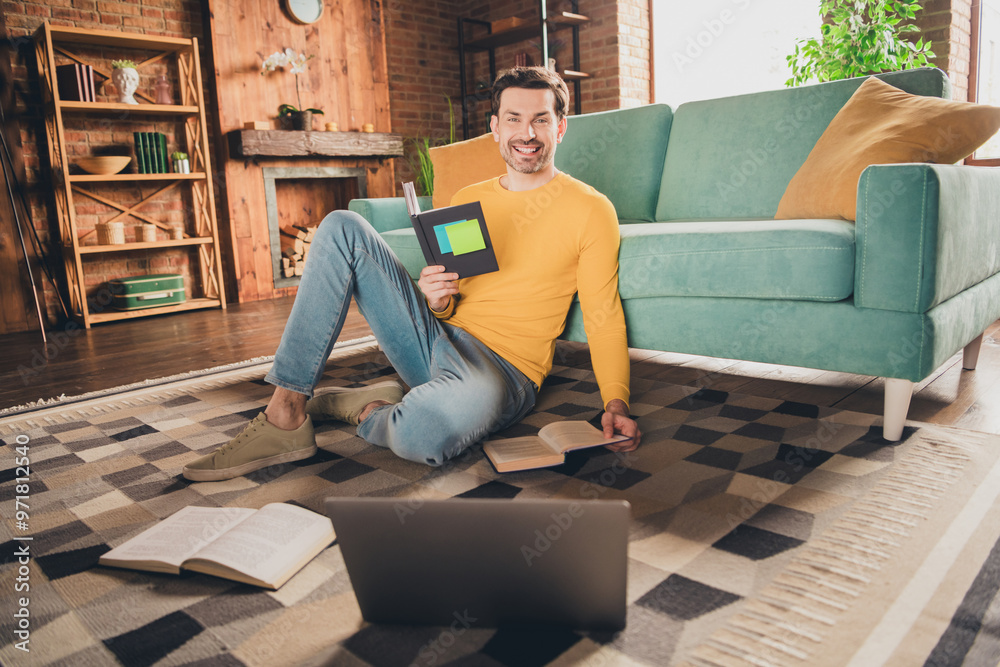 Fototapeta premium Full body photo of nice young man sit floor online study netbook wear yellow clothes modern interior flat indoors