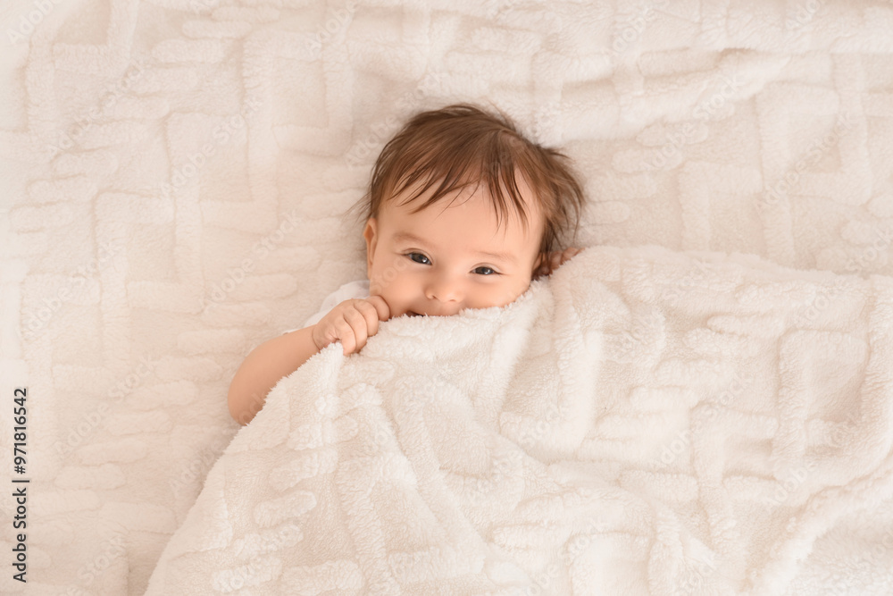 Cute little baby lying on soft plaid, closeup Cute little baby lying on soft plaid, closeup