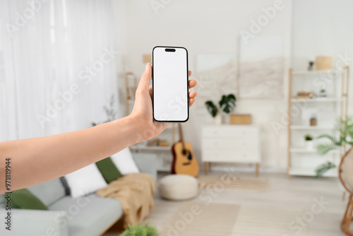 Woman with blank mobile pho...