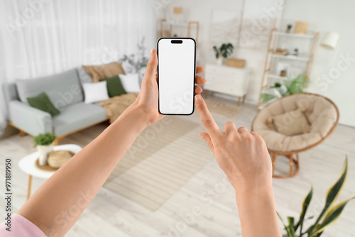 Woman using blank mobile ph...
