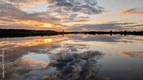 Obraz na płótnie Beautiful sunset landscaper scenery, sky reflected in Corrib river at Galway, Ireland, nature background, wallpaper w salonie