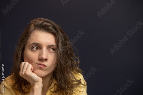 Woman looking up with puzzled expresison