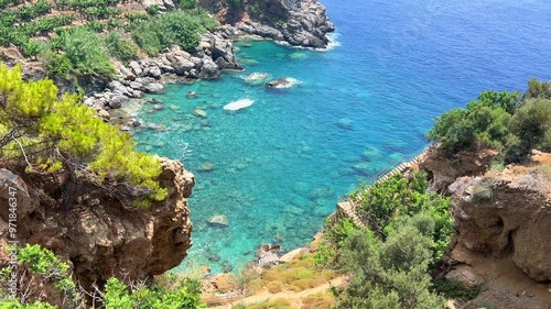 The blue lagoon in Gazipasha. A beautiful sea bay with mountains overgrown with shrubs and banana plantations descending to the sea with the purest water in the village of Guney koyu in Gazipasa. 4К photo