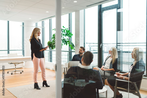 Senior woman director leading an in-office training session