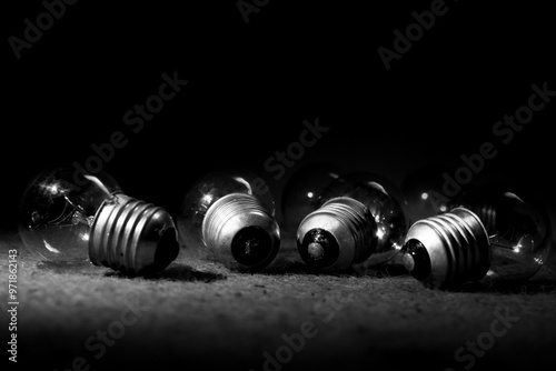 Wallpaper Mural a group of light bulbs are on the table, the light bulbs are lying on the table in a low light room Torontodigital.ca