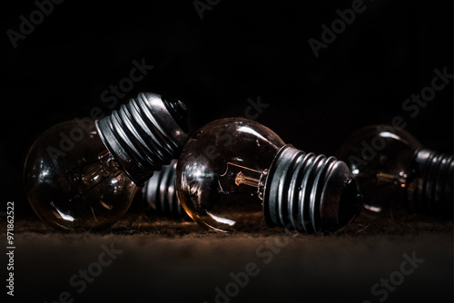 Wallpaper Mural a group of light bulbs are on the table, the light bulbs are lying on the table in a low light room Torontodigital.ca