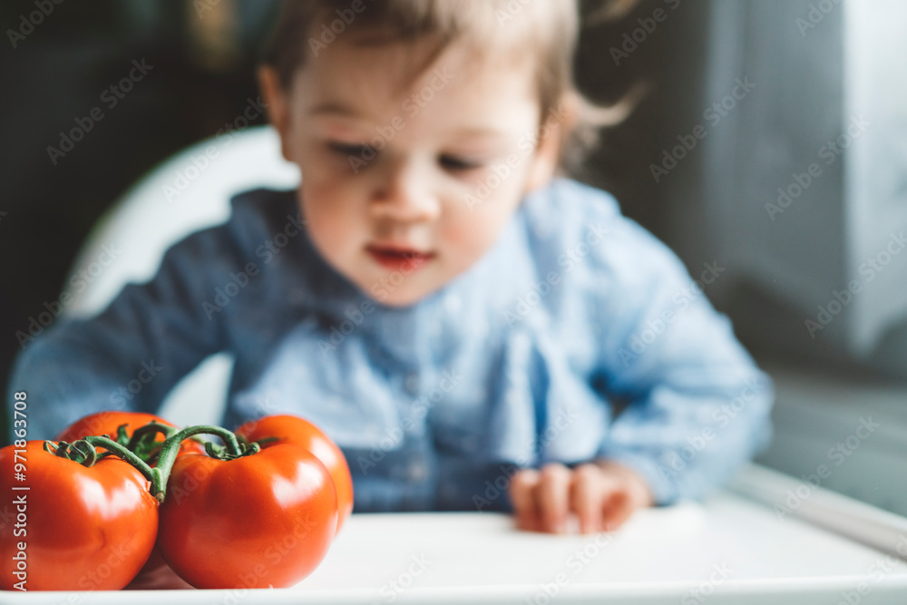 The baby is trying a new taste of solid food. Eating healthy food from the beginning is important. Young child doesn't want to eat vegetable and fruit. The baby is trying a new taste of solid food. Eating healthy food from the beginning is important. Young child doesn't want to eat vegetable and fruit.