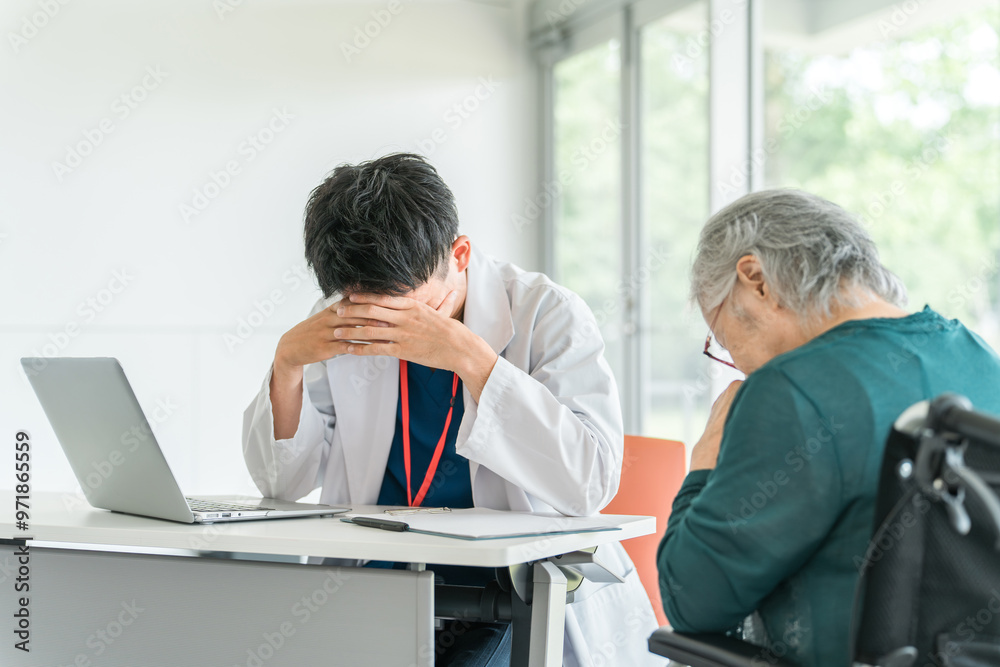 © buritora - シニア女性患者を診察中に困る・落ち込む男性医師（モンスターペイシェント・認知症）