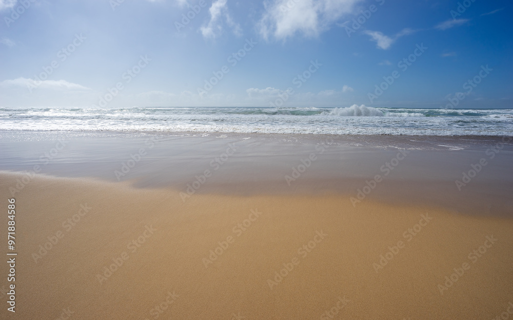 Looking out to sea, ocean straight on, waves crashing, surf breaking, seawater washing onto a sandy sub tropical beach in Queensland Looking out to sea, ocean straight on, waves crashing, surf breaking, seawater washing onto a sandy sub tropical beach in Queensland