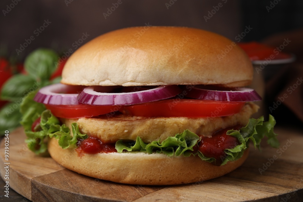 Delicious vegan burger with chickpea cutlet on wooden table, closeup Delicious vegan burger with chickpea cutlet on wooden table, closeup