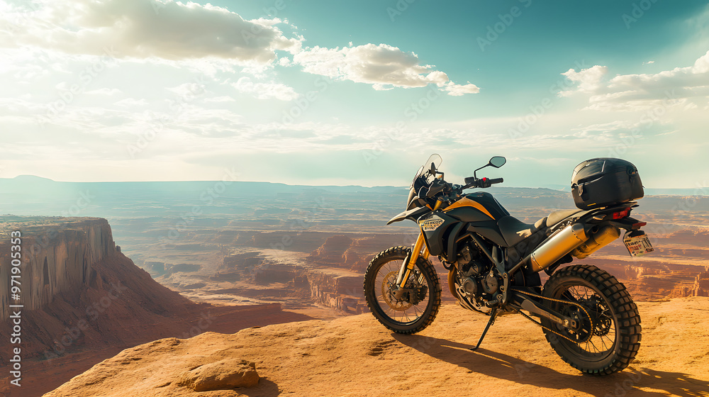A sport motorcycle parked on the edge of a cliff overlooking a vast desert landscape with the horizon stretching endlessly. A sport motorcycle parked on the edge of a cliff overlooking a vast desert landscape with the horizon stretching endlessly.
