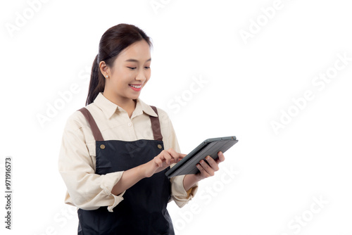 Portrait happy young asian barista woman in apron smiling while using digital tablet isolated white background, waitress or entrepreneur looking tablet, small business or startup, waiter of cafe.