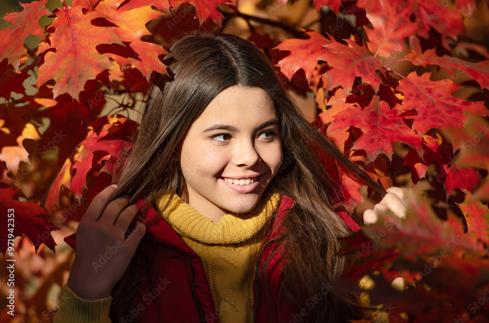 smiling kid standing at beautiful autumn leaves smiling kid standing at beautiful autumn leaves